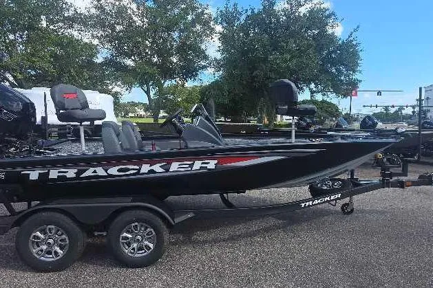 The Image of 2026 Tracker Pro Team 195 boat on trailer, parked outdoors. - 0