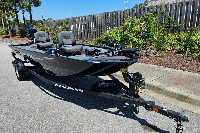 Slide: The Image of 2026 Tracker Panfish 17 boat on trailer, parked on street, sunny day. - 4