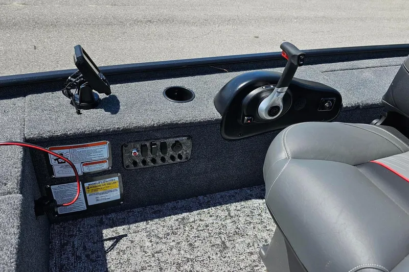 Slide: The Image of 2026 Tracker Panfish 17 boat interior with control panel and seating. - 9