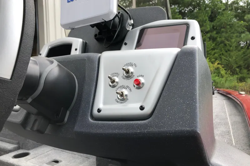 Slide: The Image of Control panel of 2026 Tracker Pro Team 195 boat with switches and display. - 10