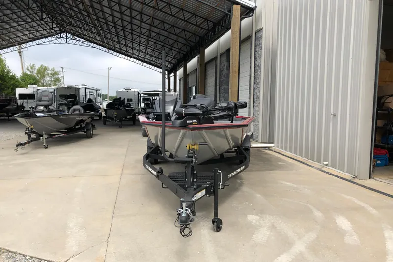 Slide: The Image of 2026 Tracker Pro Team 195 boat parked in a covered storage area. - 5