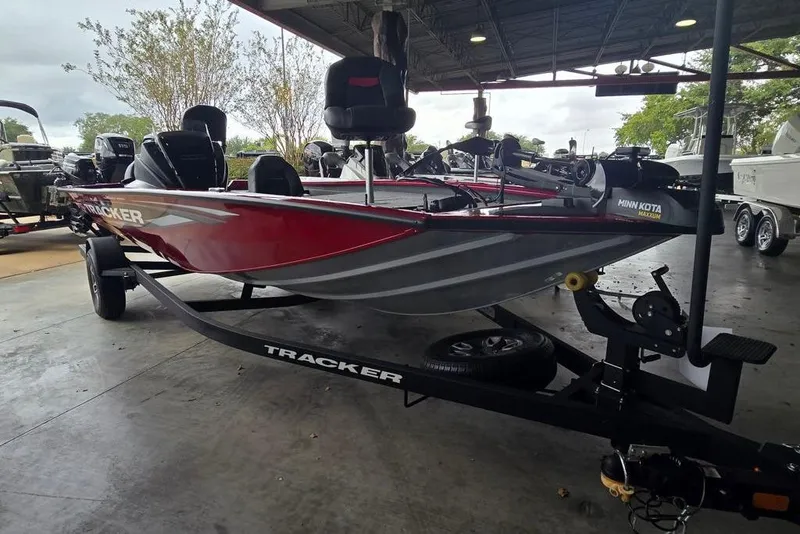The Image of 2026 Tracker Pro Team 195 boat on trailer in covered storage area. - 0