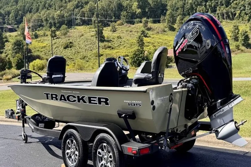 Slide: The Image of 2026 Tracker Pro Team 195 boat on trailer with powerful outboard motor. - 3