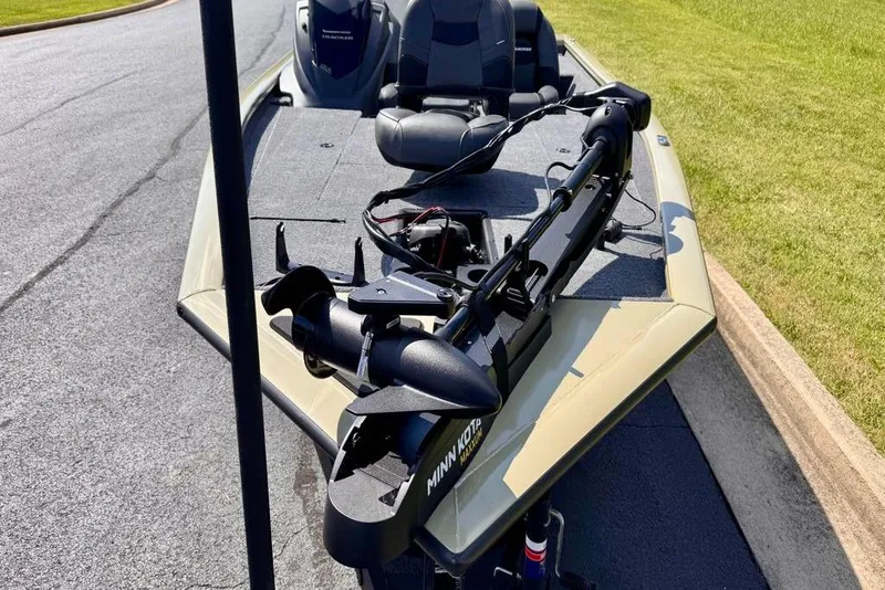 Slide: The Image of 2026 Tracker Pro Team 195 boat with Minn Kota trolling motor on a sunny day. - 5