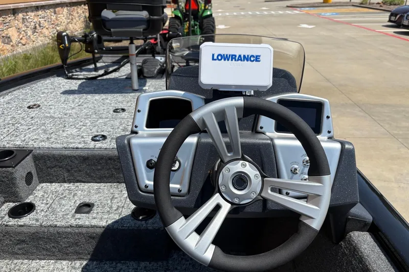 Slide: The Image of 2026 Tracker Pro Team 195 boat dashboard with Lowrance electronics and modern steering wheel. - 5