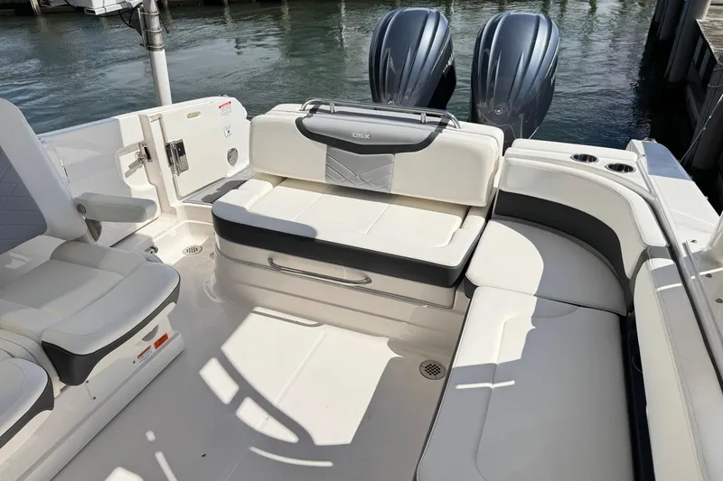 Slide: The Image of 2022 Chaparral 280 OSX boat interior with seating and dual engines. - 14