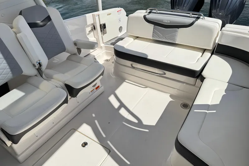 Slide: The Image of 2022 Chaparral 280 OSX boat interior with luxurious seating and modern design. - 15