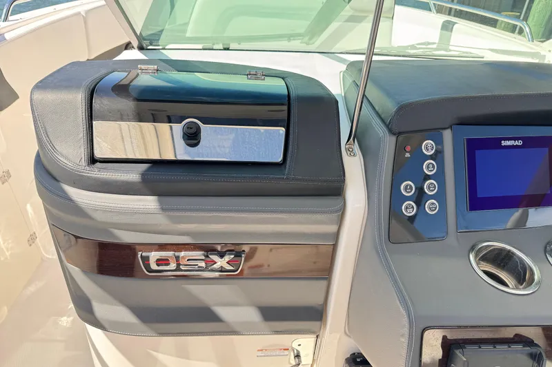 Slide: The Image of 2022 Chaparral 280 OSX boat dashboard with control panel and display screen. - 22