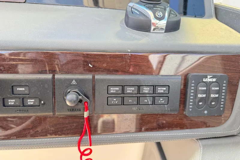 Slide: The Image of Control panel of 2022 Chaparral 280 OSX boat with Yamaha and Lenco controls. - 24