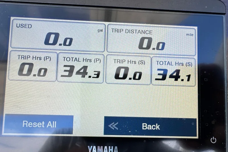 Slide: The Image of Dashboard display of a 2022 Chaparral 280 OSX showing trip and total hours. - 25