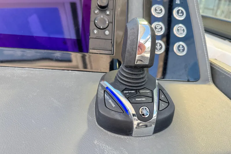 Slide: The Image of Joystick control on 2022 Chaparral 280 OSX boat dashboard with navigation buttons. - 26