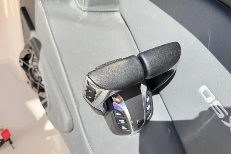 Slide: The Image of Throttle control of 2022 Chaparral 280 OSX boat, featuring ergonomic design and controls. - 27