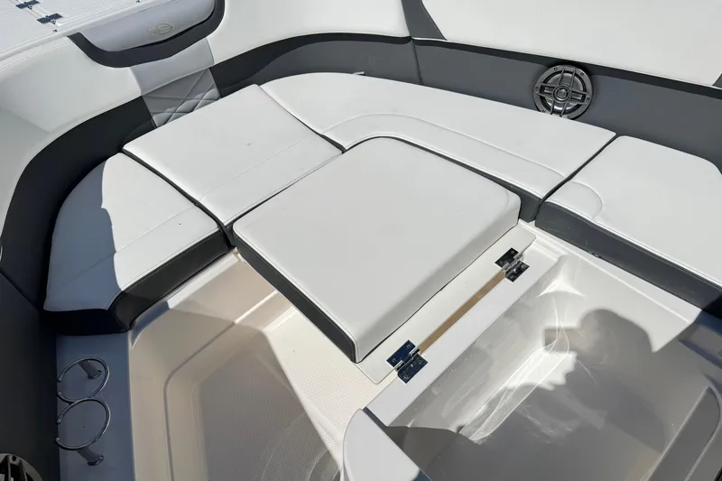 Slide: The Image of 2022 Chaparral 280 OSX boat interior seating with storage compartment open. - 32