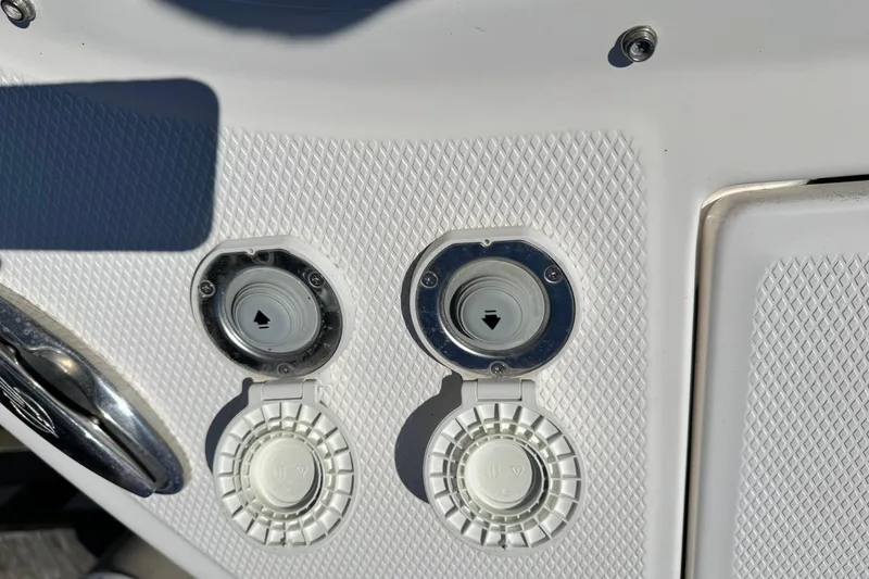 Slide: The Image of Close-up of 2022 Chaparral 280 OSX boat fuel and water inlets. - 34