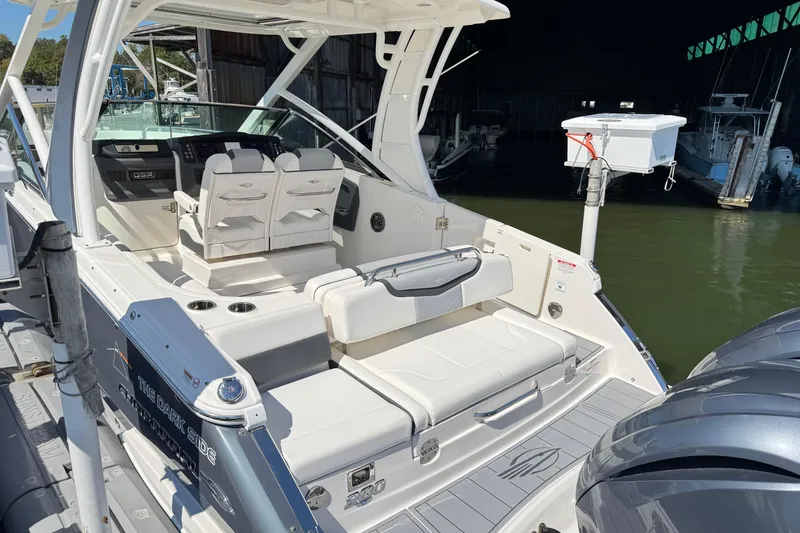 Slide: The Image of 2022 Chaparral 280 OSX boat interior with seating and control panel. - 8