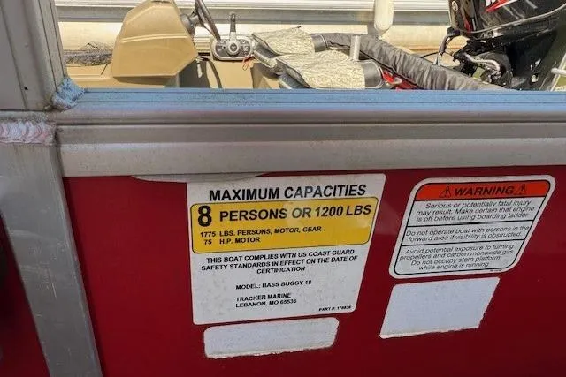 Slide: The Image of 2017 Sun Tracker Bass Buggy 18 DLX capacity label, maximum 8 persons or 1200 lbs. - 13