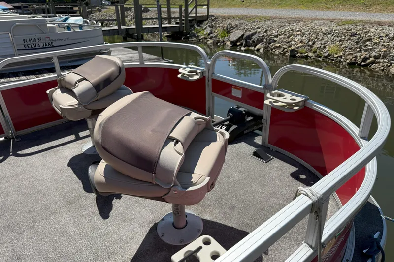 Slide: The Image of 2017 Sun Tracker Bass Buggy 18 DLX pontoon boat with comfortable seating and fishing setup. - 15