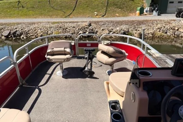 Slide: The Image of 2017 Sun Tracker Bass Buggy 18 DLX pontoon boat with seating and fishing setup. - 3