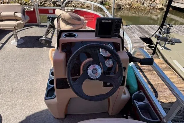 Slide: The Image of 2017 Sun Tracker Bass Buggy 18 DLX steering console with gauges and fish finder. - 4