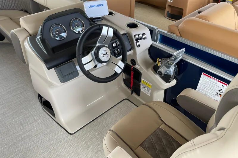 Slide: The Image of 2026 Harris Cruiser 230 boat dashboard with steering wheel and control panel. - 11