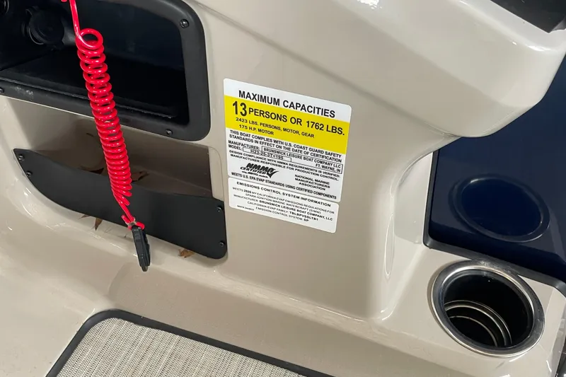 Slide: The Image of 2026 Harris Cruiser 230 boat capacity label, 13 persons or 1762 lbs, with red safety cord. - 12