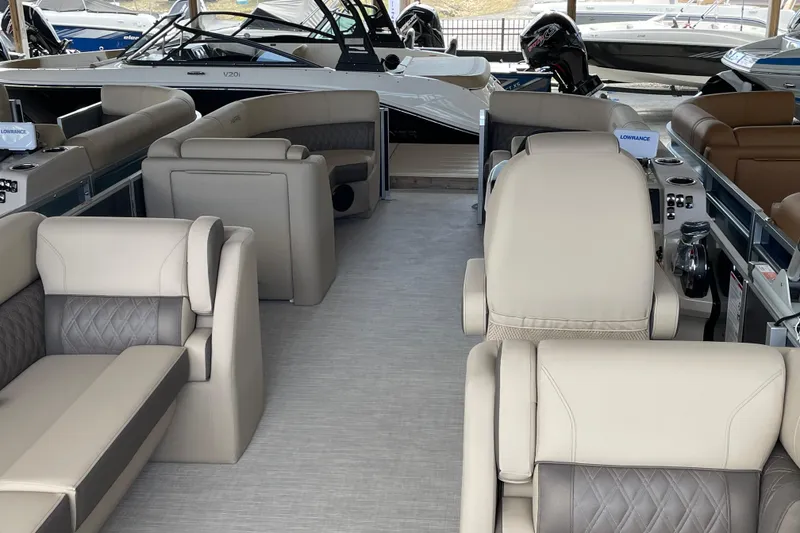 Slide: The Image of Interior of a 2026 Harris Cruiser 230 pontoon boat with luxurious seating. - 18