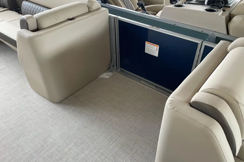 Slide: The Image of 2026 Harris Cruiser 230 interior with beige seating and modern design. - 23