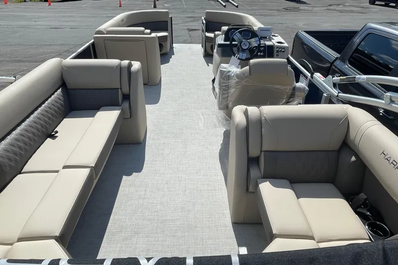 Slide: The Image of 2026 Harris Cruiser 230 CW pontoon boat interior with luxurious seating and modern helm. - 5