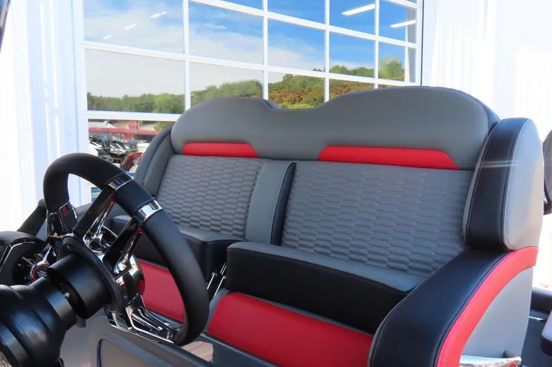 Slide: The Image of 2026 Sunsation 32CCX boat interior with sleek steering wheel and stylish seating design. - 11