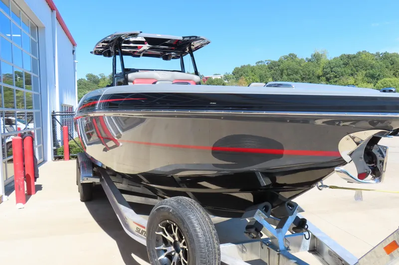 Slide: The Image of 2026 Sunsation 32CCX boat on trailer, sleek black design with red accents. - 24