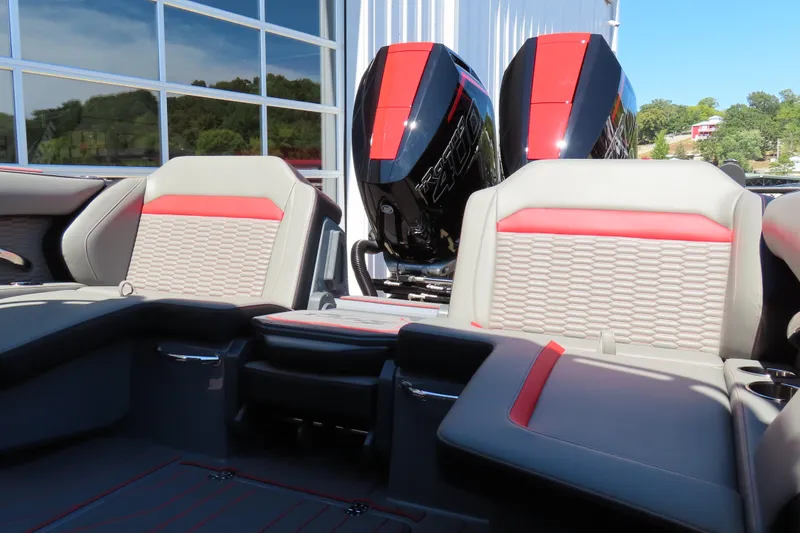 Slide: The Image of 2026 Sunsation 32CCX boat interior with red and gray seating, dual engines visible. - 26