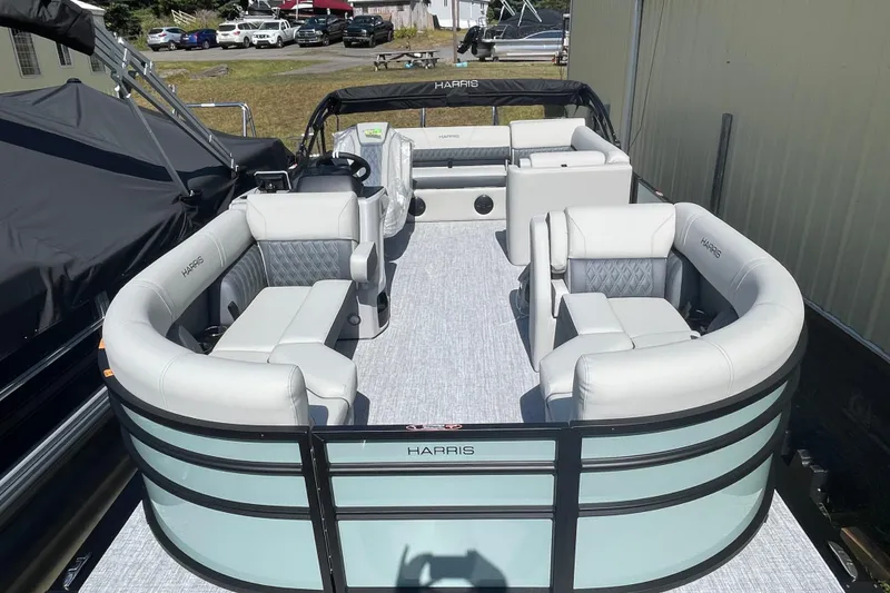 Slide: The Image of 2026 Harris Cruiser 210 SL pontoon boat with luxurious seating and modern design. - 7