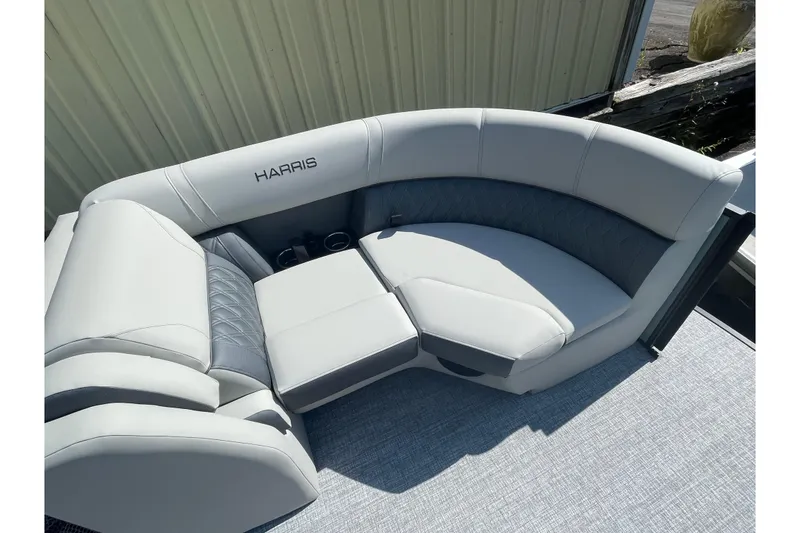 Slide: The Image of Luxurious seating on 2026 Harris Cruiser 210 pontoon boat, featuring elegant gray upholstery. - 9