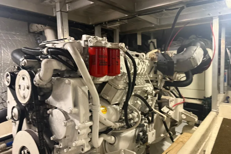 Slide: The Image of Engine room of a 2003 Navigator 53 yacht, showcasing detailed machinery components. - 10