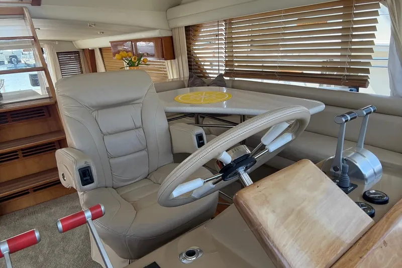 Slide: The Image of Luxurious 2003 Navigator 53 yacht interior with leather seating and wooden accents. - 6