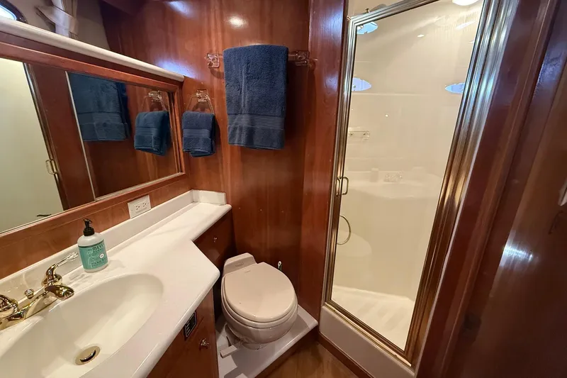 Slide: The Image of Luxurious bathroom in 2003 Navigator 53 yacht with shower, sink, and toilet. - 7