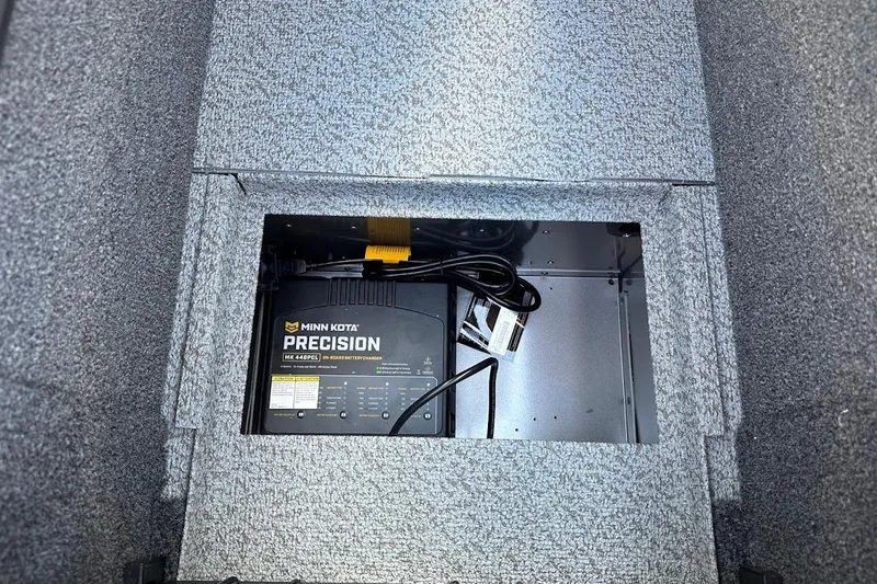 Slide: The Image of Minn Kota Precision charger in 2025 Lund 1875 Pro-V boat compartment. - 34