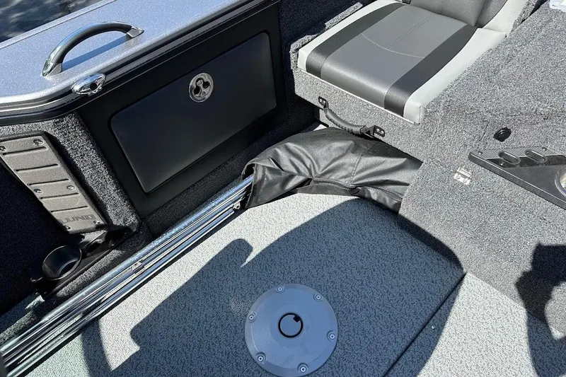 Slide: The Image of 2025 Lund 1875 Pro-V boat interior with storage compartment and seating. - 41