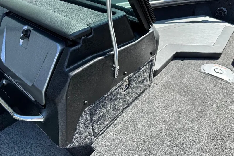 Slide: The Image of Interior view of 2025 Lund 1875 Pro-V boat, featuring storage and seating area. - 44