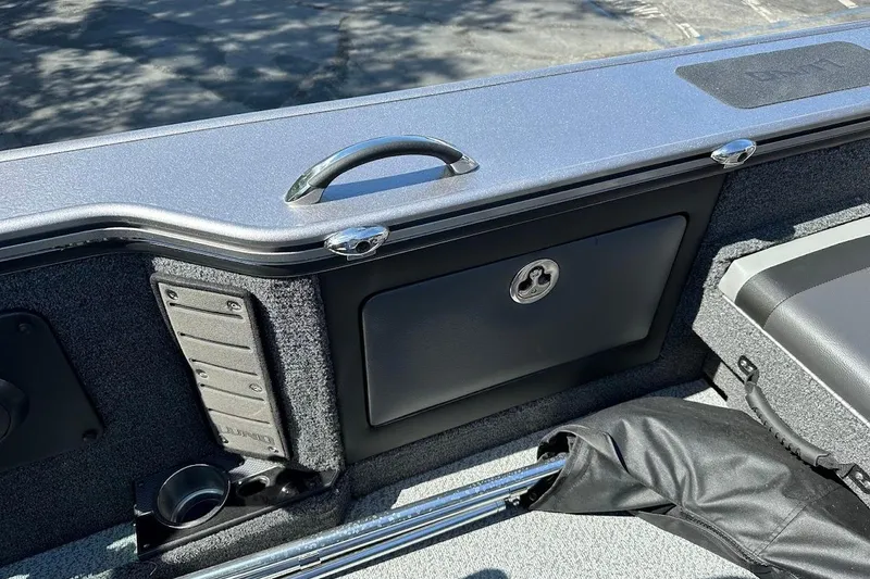 Slide: The Image of 2025 Lund 1875 Pro-V boat interior with storage compartment and handle. - 46