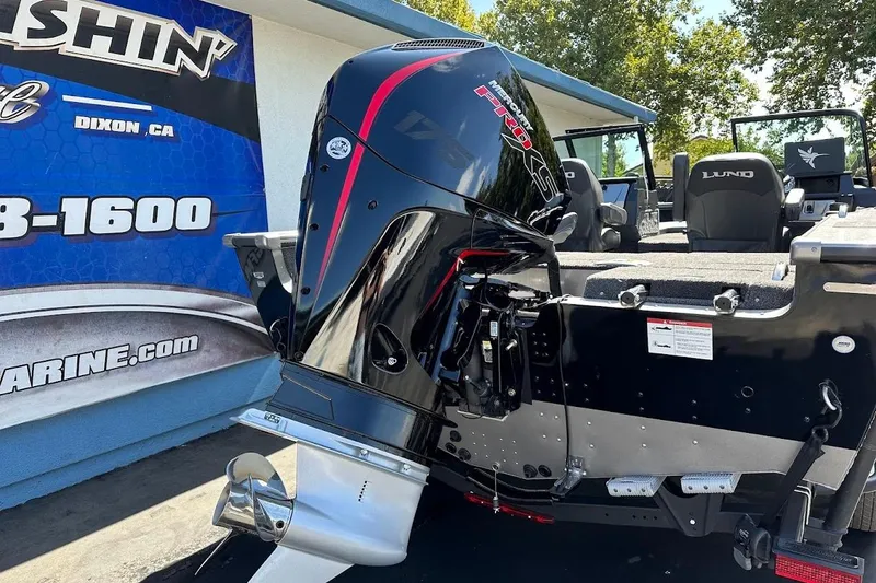 Slide: The Image of 2025 Lund 1875 Pro-V boat with powerful outboard motor, displayed outdoors. - 8