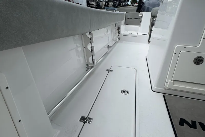 Slide: The Image of 2020 Sportsman Open 282TE Center Console boat interior, featuring sleek white deck and seating. - 14