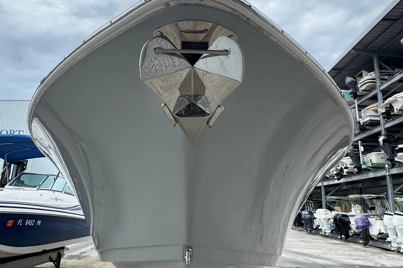 Slide: The Image of 2020 Sportsman Open 282TE Center Console boat lifted by forklift in marina storage. - 2