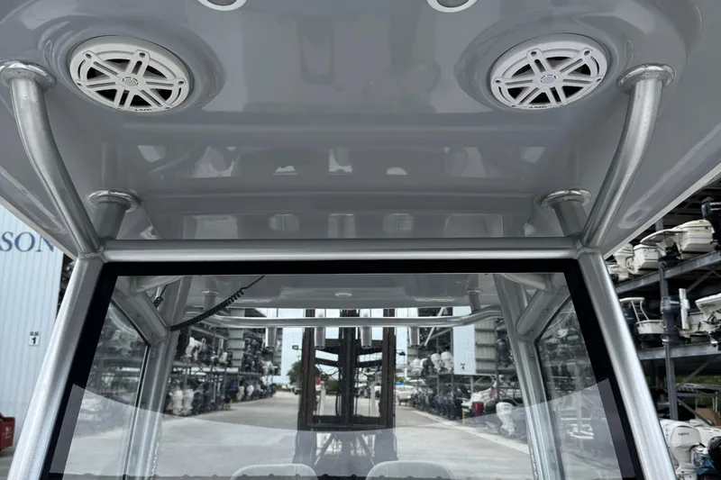 Slide: The Image of 2020 Sportsman Open 282TE Center Console boat interior with speakers and sturdy frame. - 24