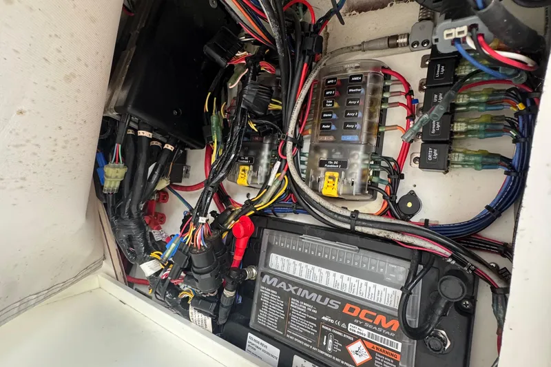 Slide: The Image of Electrical wiring and components inside a 2020 Sportsman Open 282TE Center Console boat. - 27