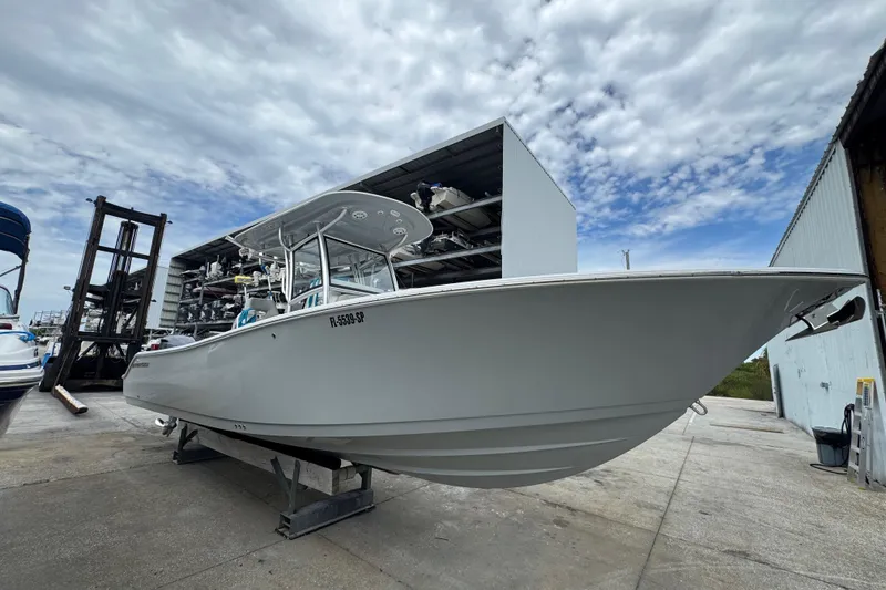 Slide: The Image of 2020 Sportsman Open 282TE Center Console boat, front view in storage facility. - 3