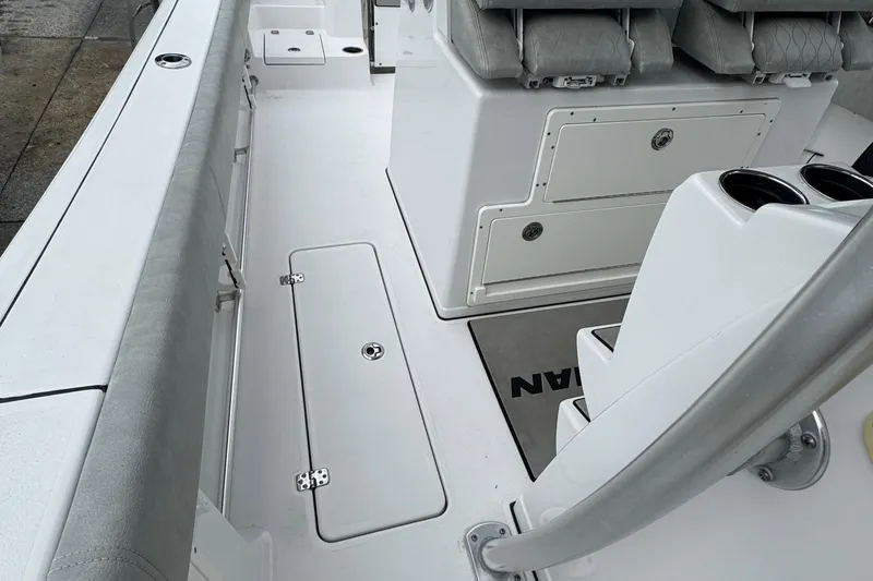 Slide: The Image of 2020 Sportsman Open 282TE Center Console boat interior with seating and storage compartments. - 4