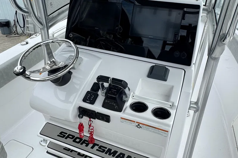 Slide: The Image of 2020 Sportsman Open 282TE Center Console dashboard with steering wheel and controls. - 6