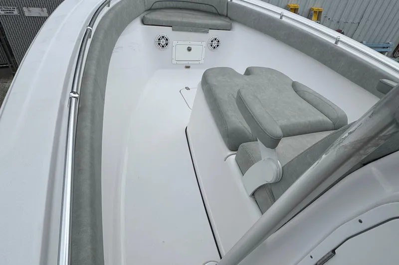 Slide: The Image of 2020 Sportsman Open 282TE Center Console boat interior with cushioned seating. - 8