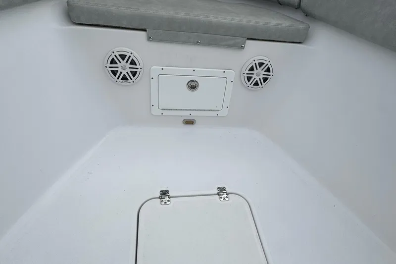 Slide: The Image of 2020 Sportsman Open 282TE Center Console interior with speakers and storage hatch. - 9